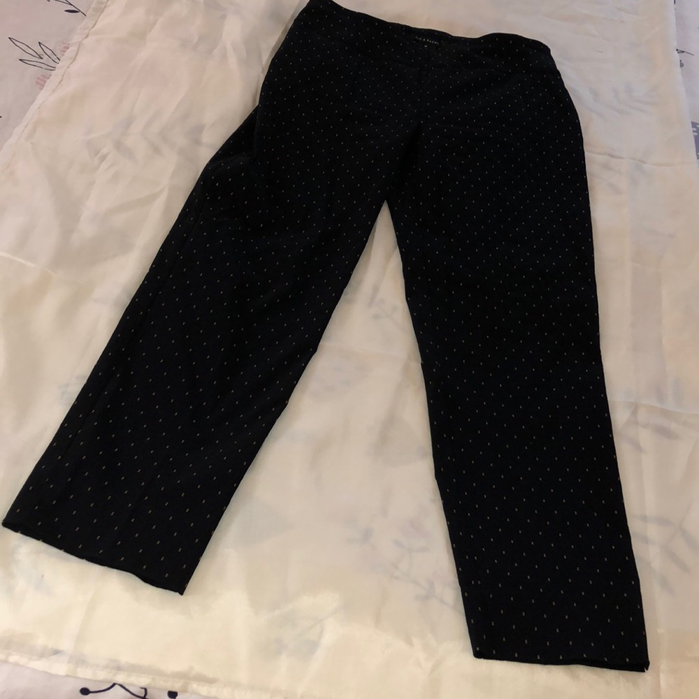 Black and gold legging-style pants.